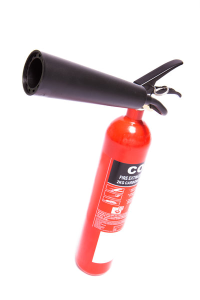 Red fire extinguisher on a tilt